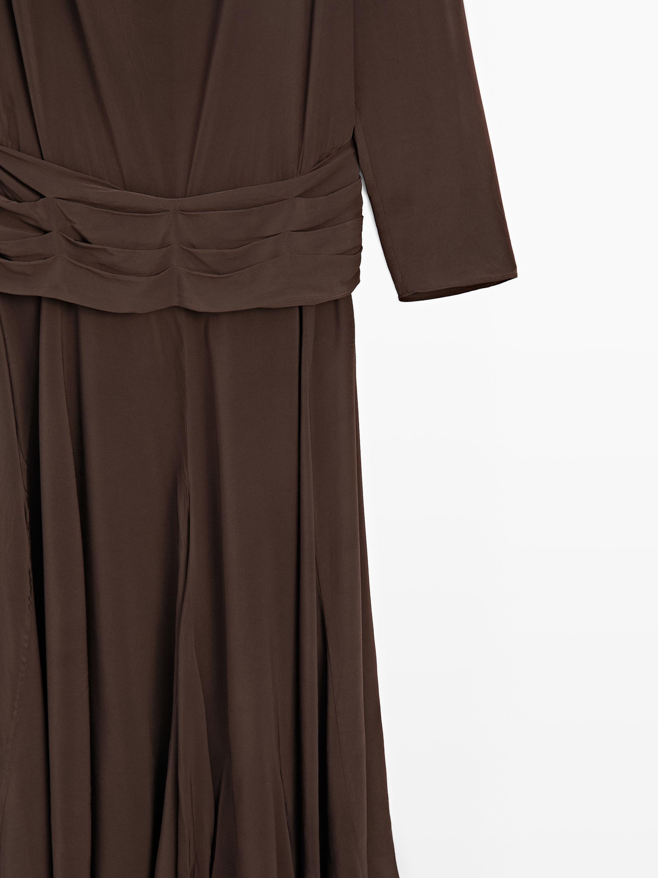 Long flowing dress with draped sash belt